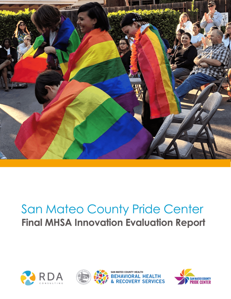 Pride Center celebration with rainbow flags.