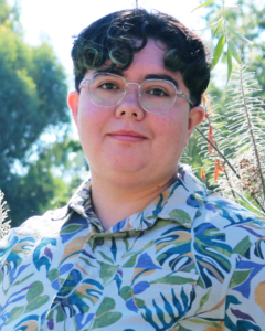 Portrait of person wearing glasses and shirt.